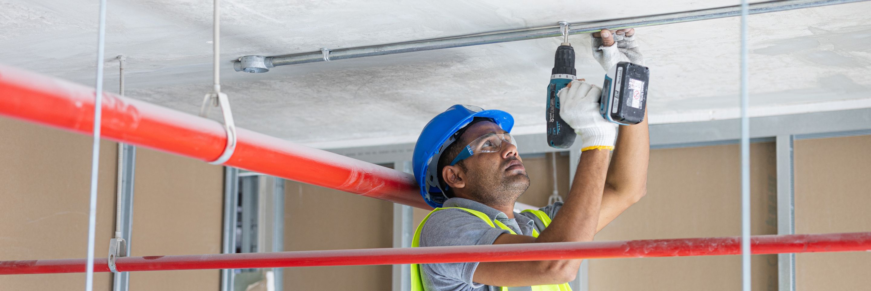 education fitouts uae person doing construction work