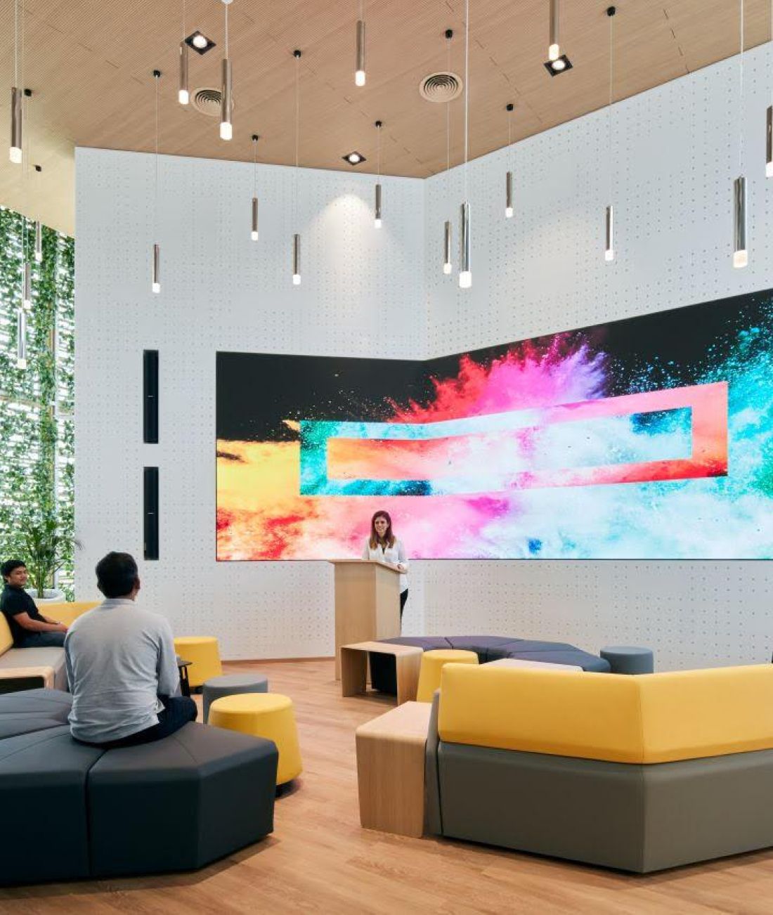 commercial interior fit out contractors abu dhabi room with large display screen and seating area