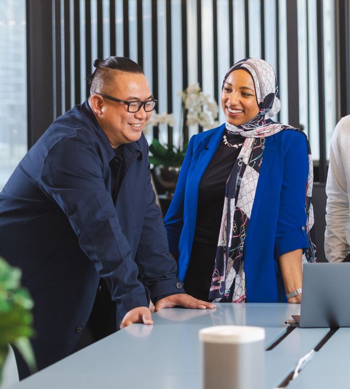 commercial interior fit out companies abu dhabi two people in a meeting and smiling