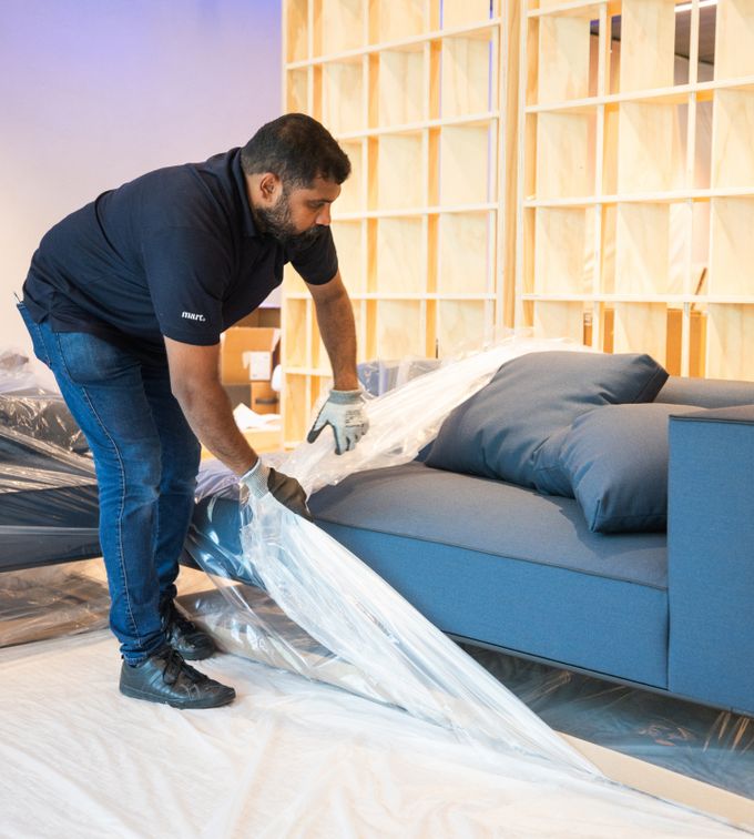 fit outs uae person unwrapping new furniture