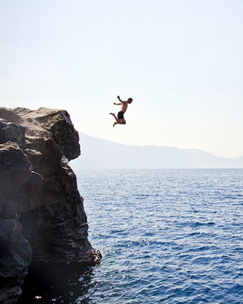 interior fit outs abu dhabi person jumping into the ocean