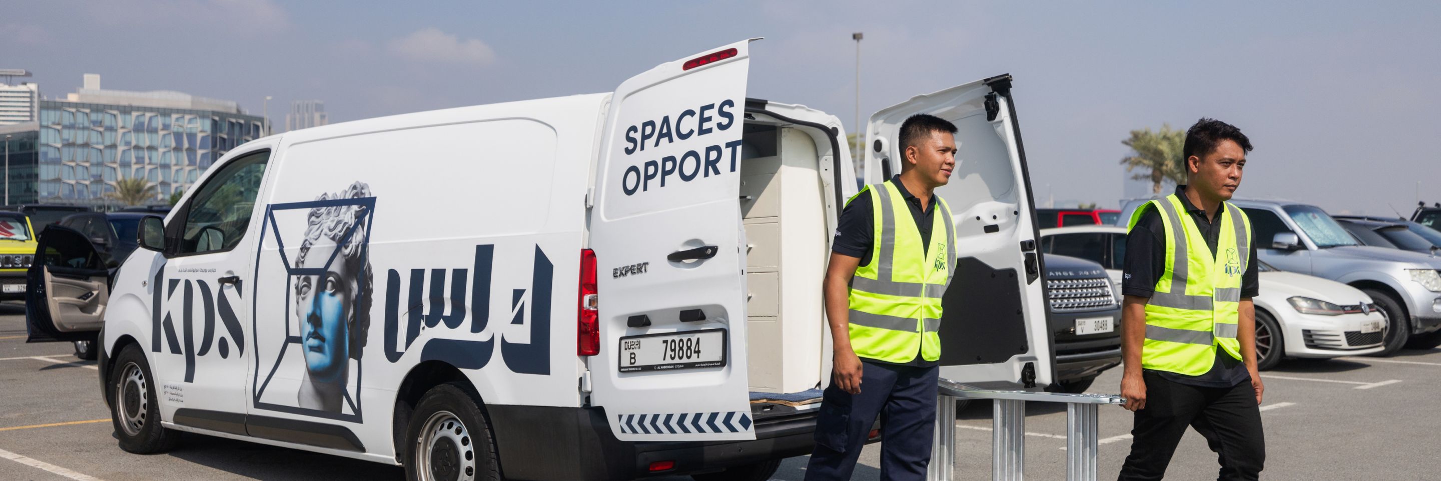 interior fit outs abu dhabi people unloading equipment from a van