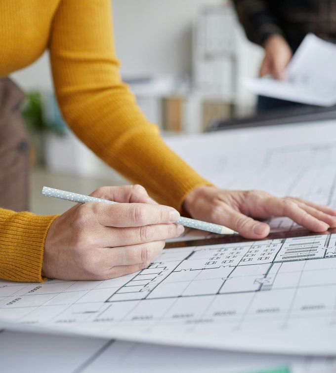 interior fit outs uae person drawing diagrams