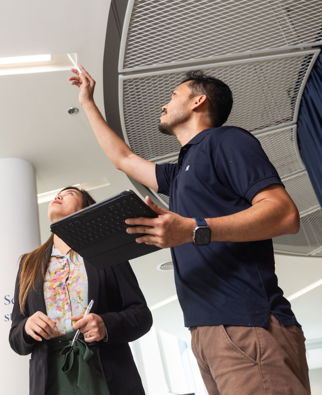 best commercial interior fit out companies abu dhabi people inspecting a ceiling