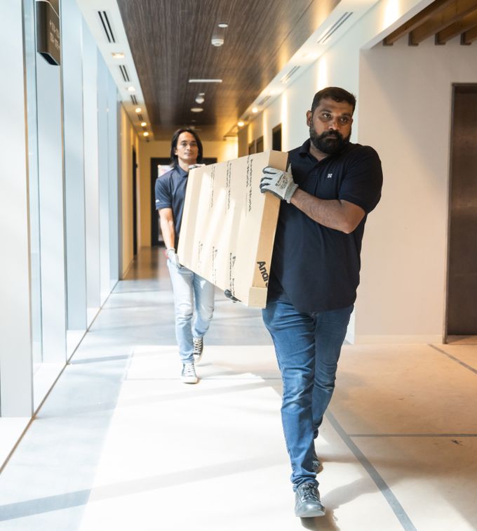 Commercial Interiors Dubai people moving furniture
