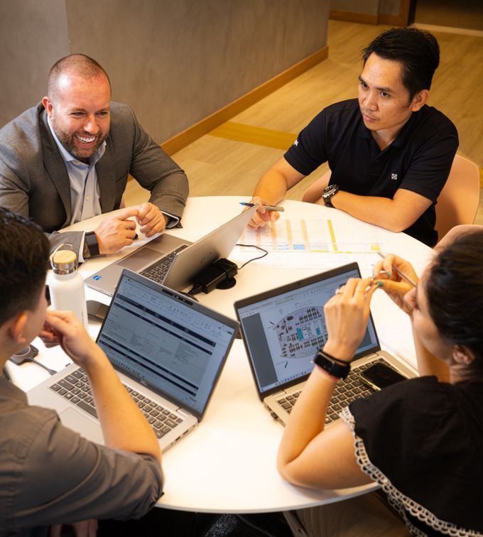 abu dhabi commercial interior fit out companies people having a meeting around a round table