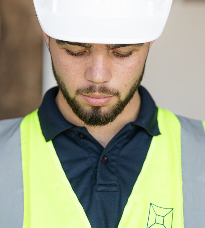uae fit outs person wearing a hard hat and safety vest